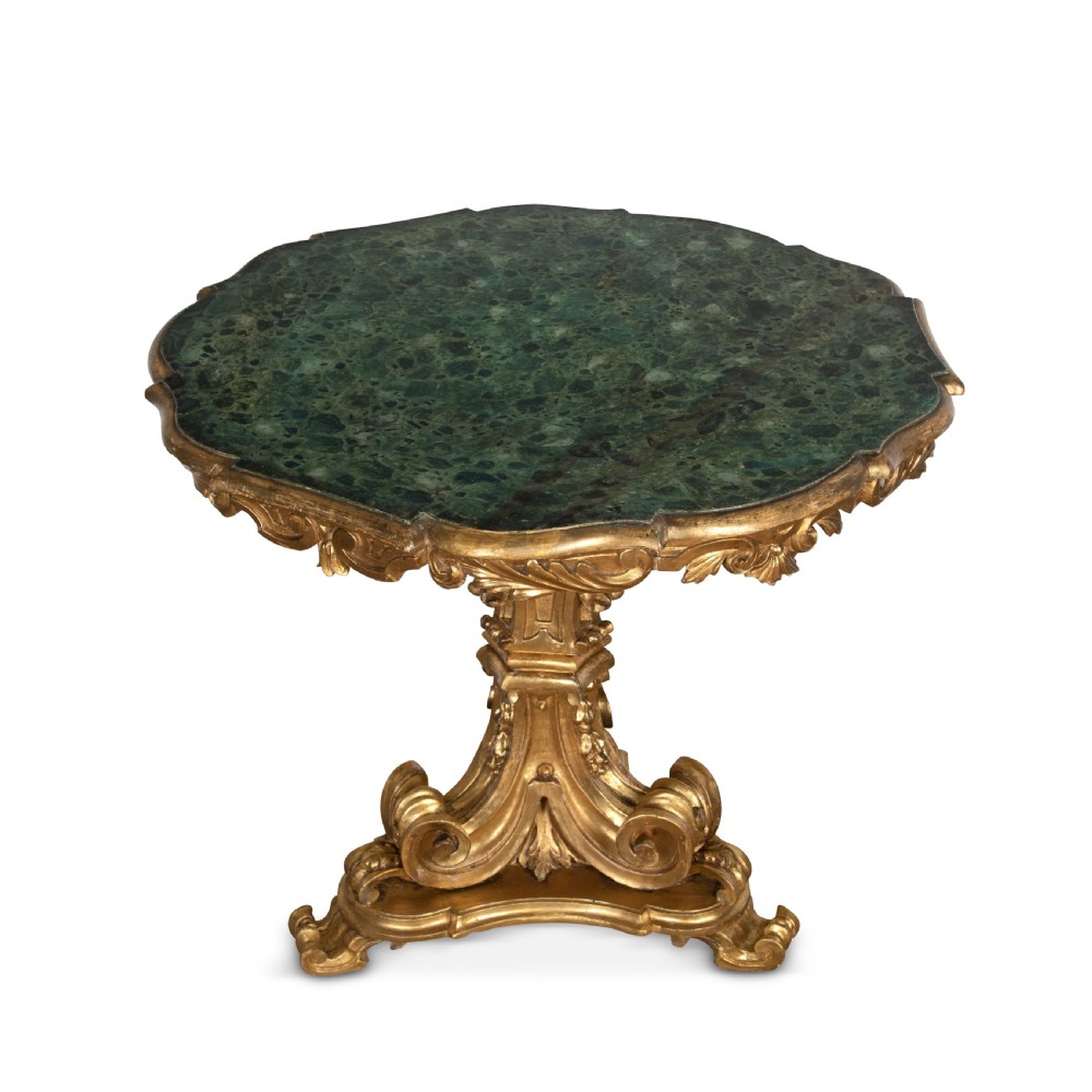 A 19th-century Italian centre table featuring a scalloped green marble top set upon a heavily carved giltwood pedestal base with scroll legs. View II