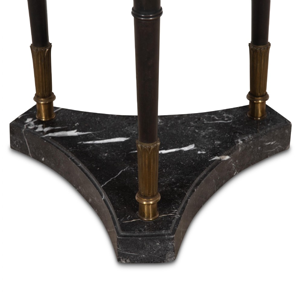 A 19th-century French Empire bronze Athenienne featuring a pierced metal gallery, winged caryatid legs, and a triangular dark marble base. View X