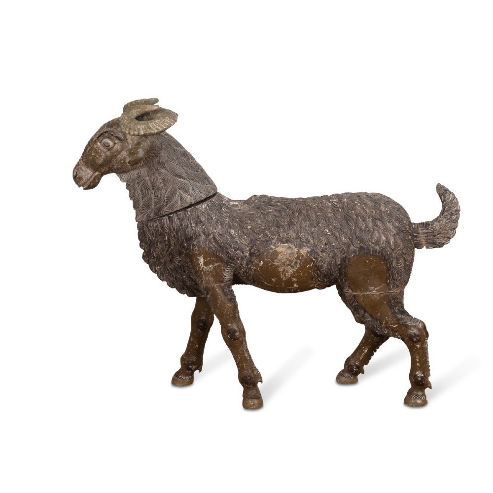 A 19th-century life-size hand-carved wooden goat sculpture with curved horns and a distressed brown painted finish. View II