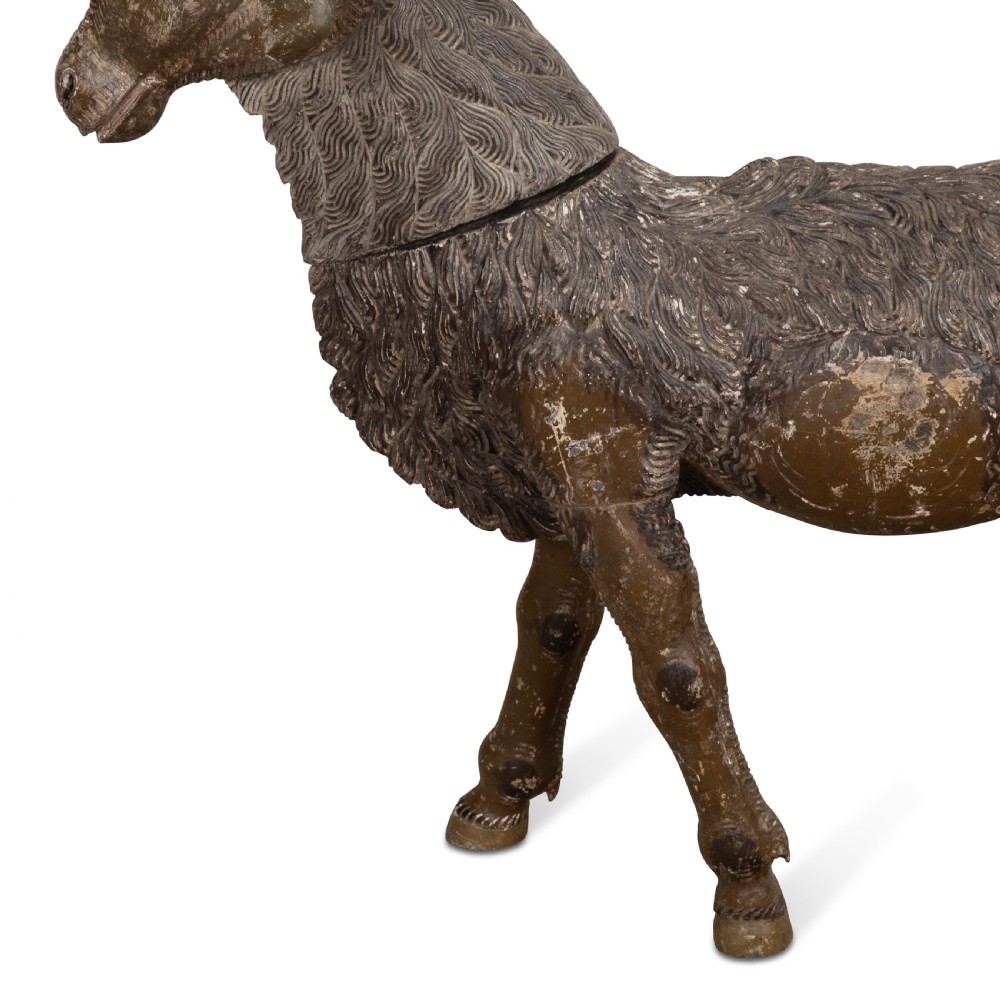 A 19th-century life-size hand-carved wooden goat sculpture with curved horns and a distressed brown painted finish. View III