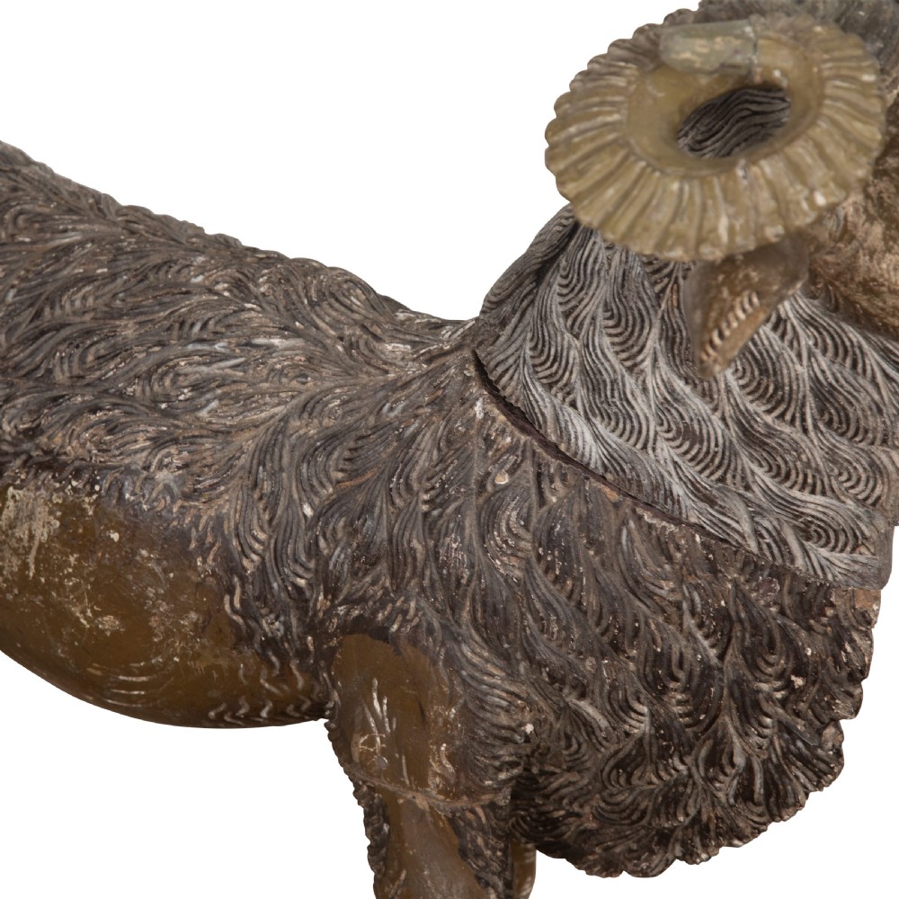 A 19th-century life-size hand-carved wooden goat sculpture with curved horns and a distressed brown painted finish. View V