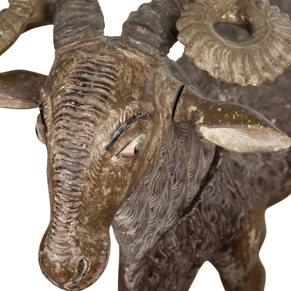 A 19th-century life-size hand-carved wooden goat sculpture with curved horns and a distressed brown painted finish. View VIII