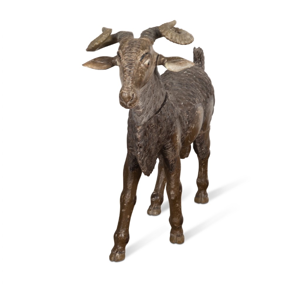 A 19th-century life-size hand-carved wooden goat sculpture with curved horns and a distressed brown painted finish. View XI
