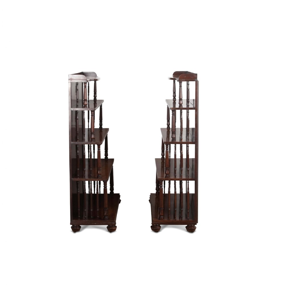 A matching pair of dark brown 19th-century Regency mahogany open bookcases featuring four tiers supported by turned side spindles. View IV