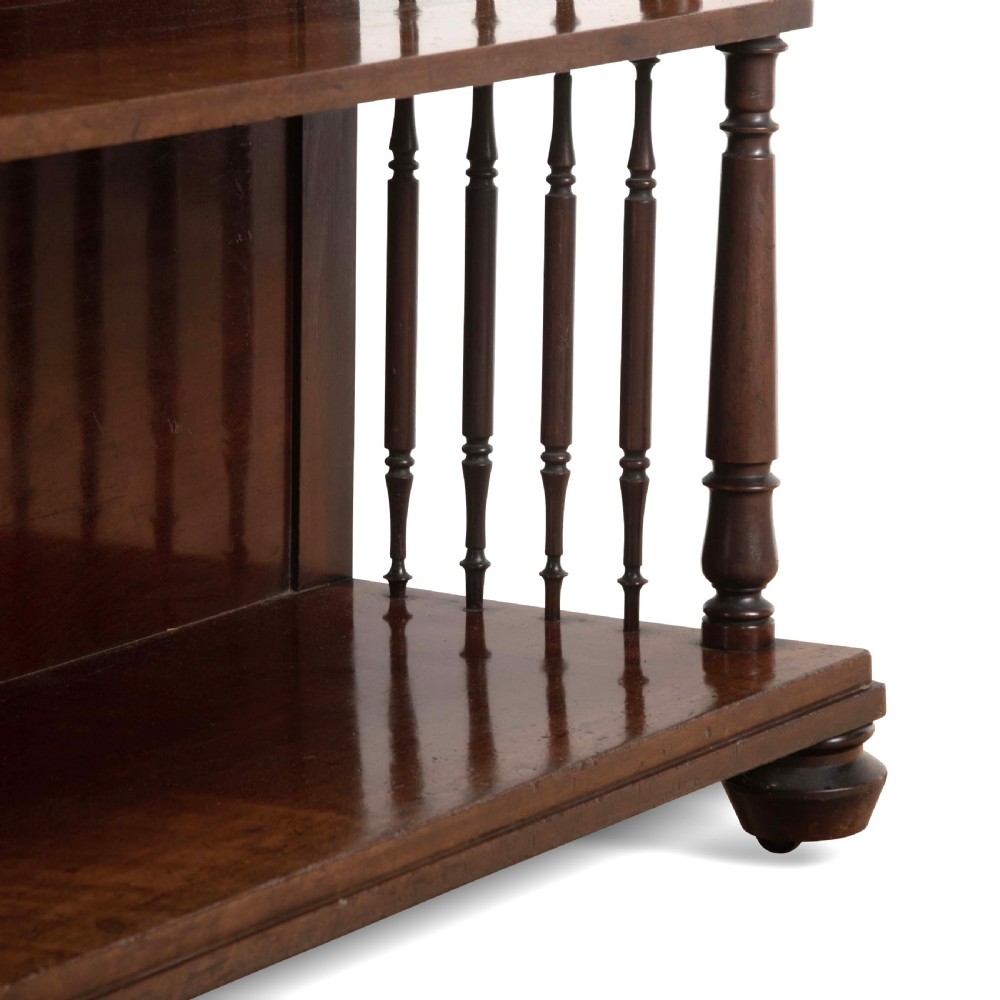 A matching pair of dark brown 19th-century Regency mahogany open bookcases featuring four tiers supported by turned side spindles. View VIII