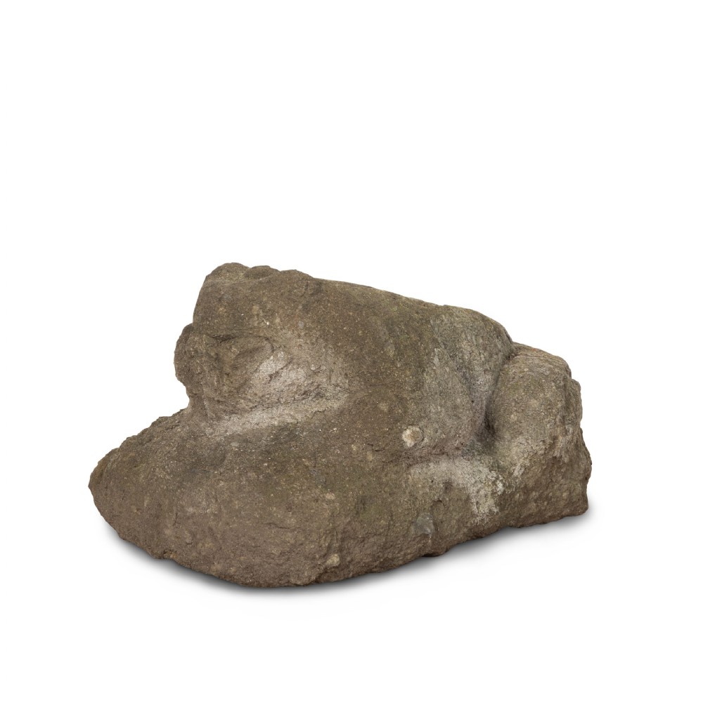 A hand-carved grey stone sculpture depicting a sitting frog with weathered surface textures.