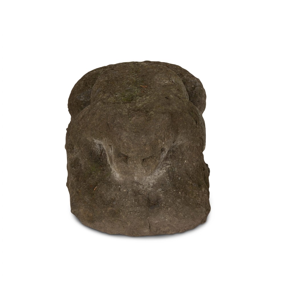 A hand-carved grey stone sculpture depicting a sitting frog with weathered surface textures. View II