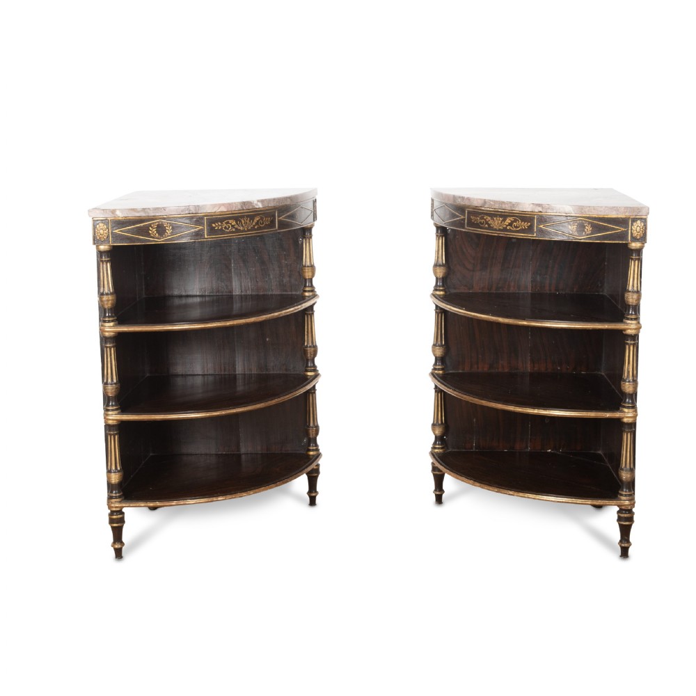 A pair of Regency-style black painted open corner cabinets featuring marble tops, gilt floral scrollwork friezes, and turned support columns. View III