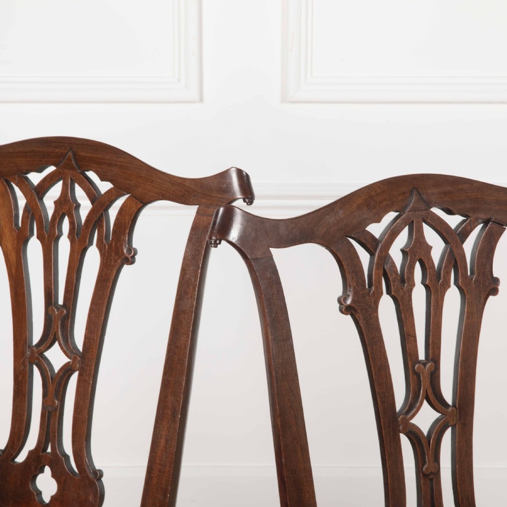 A pair of 18th-century mahogany side chairs featuring pierced Gothic tracery splats and red velvet upholstered seats. View III