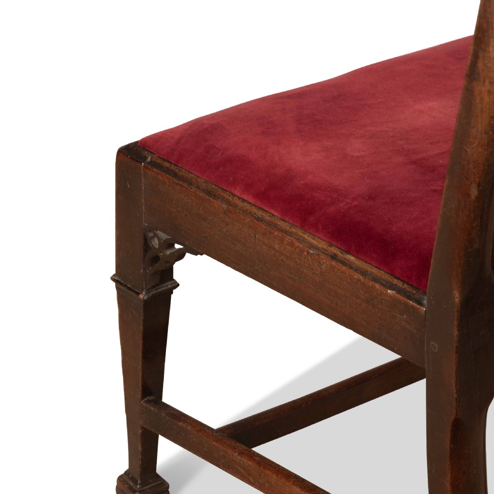 A pair of 18th-century mahogany side chairs featuring pierced Gothic tracery splats and red velvet upholstered seats. View VIII