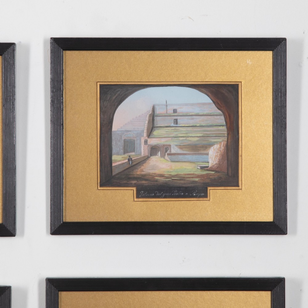 A set of six 19th-century framed gouache paintings depicting Italian classical ruins and coastal views with gold mounts and black frames. View IV