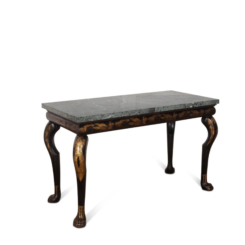 A Regency style ebonised and gilt Chinoiserie console table featuring a grey-green marble top and carved cabriole legs with paw feet.