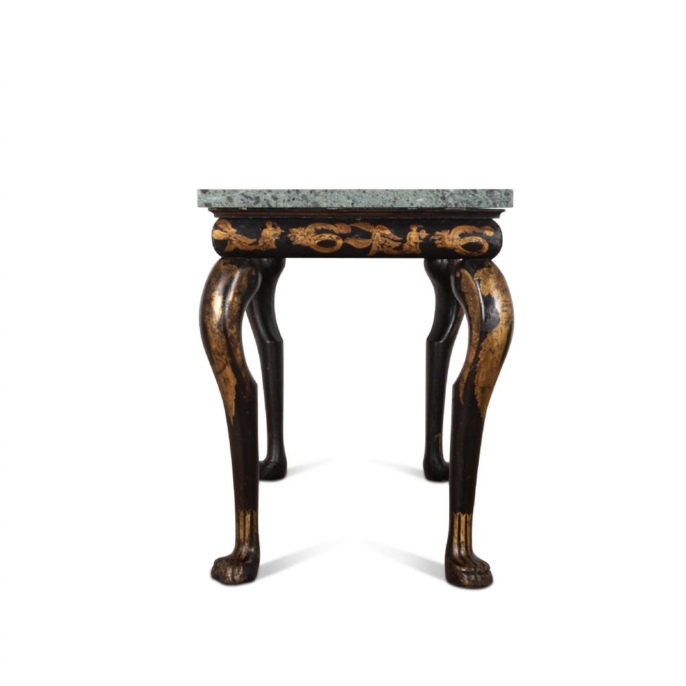 A Regency style ebonised and gilt Chinoiserie console table featuring a grey-green marble top and carved cabriole legs with paw feet. View V