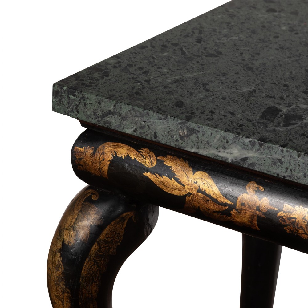 A Regency style ebonised and gilt Chinoiserie console table featuring a grey-green marble top and carved cabriole legs with paw feet. View VII