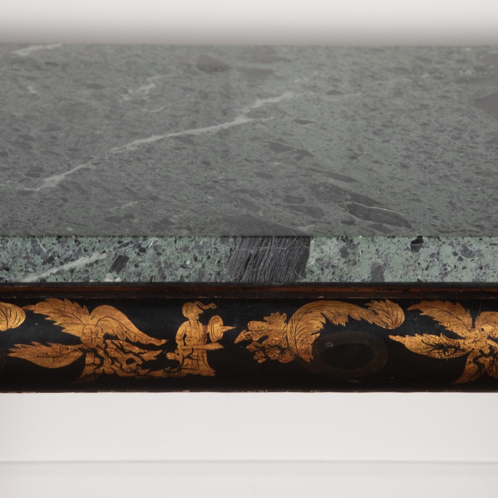 A Regency style ebonised and gilt Chinoiserie console table featuring a grey-green marble top and carved cabriole legs with paw feet. View VIII