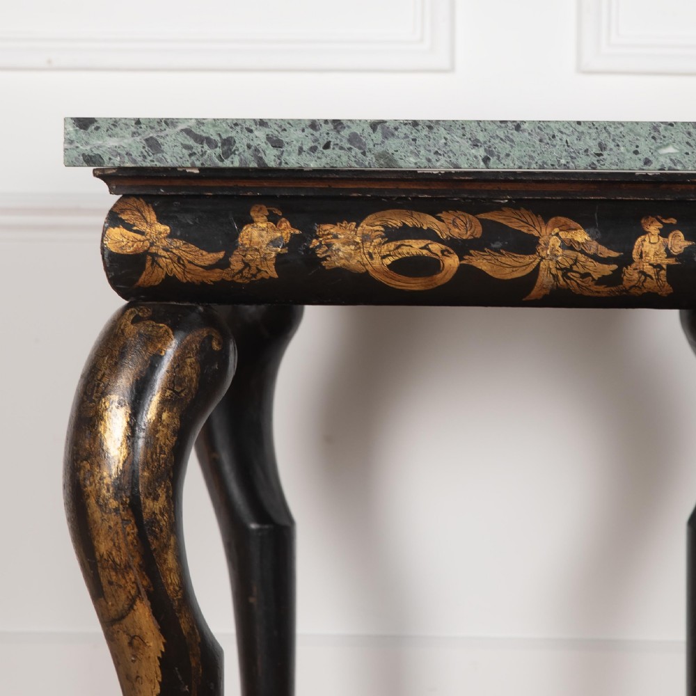 A Regency style ebonised and gilt Chinoiserie console table featuring a grey-green marble top and carved cabriole legs with paw feet. View X