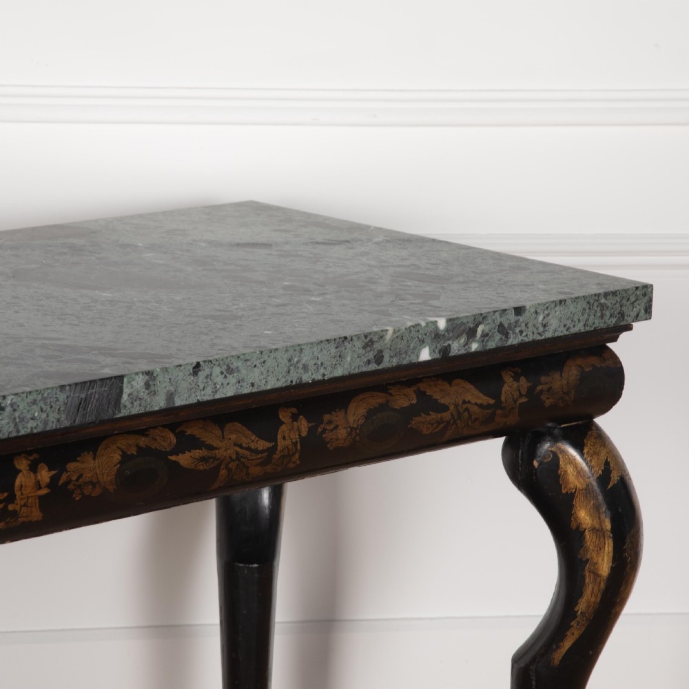 A Regency style ebonised and gilt Chinoiserie console table featuring a grey-green marble top and carved cabriole legs with paw feet. View XIII