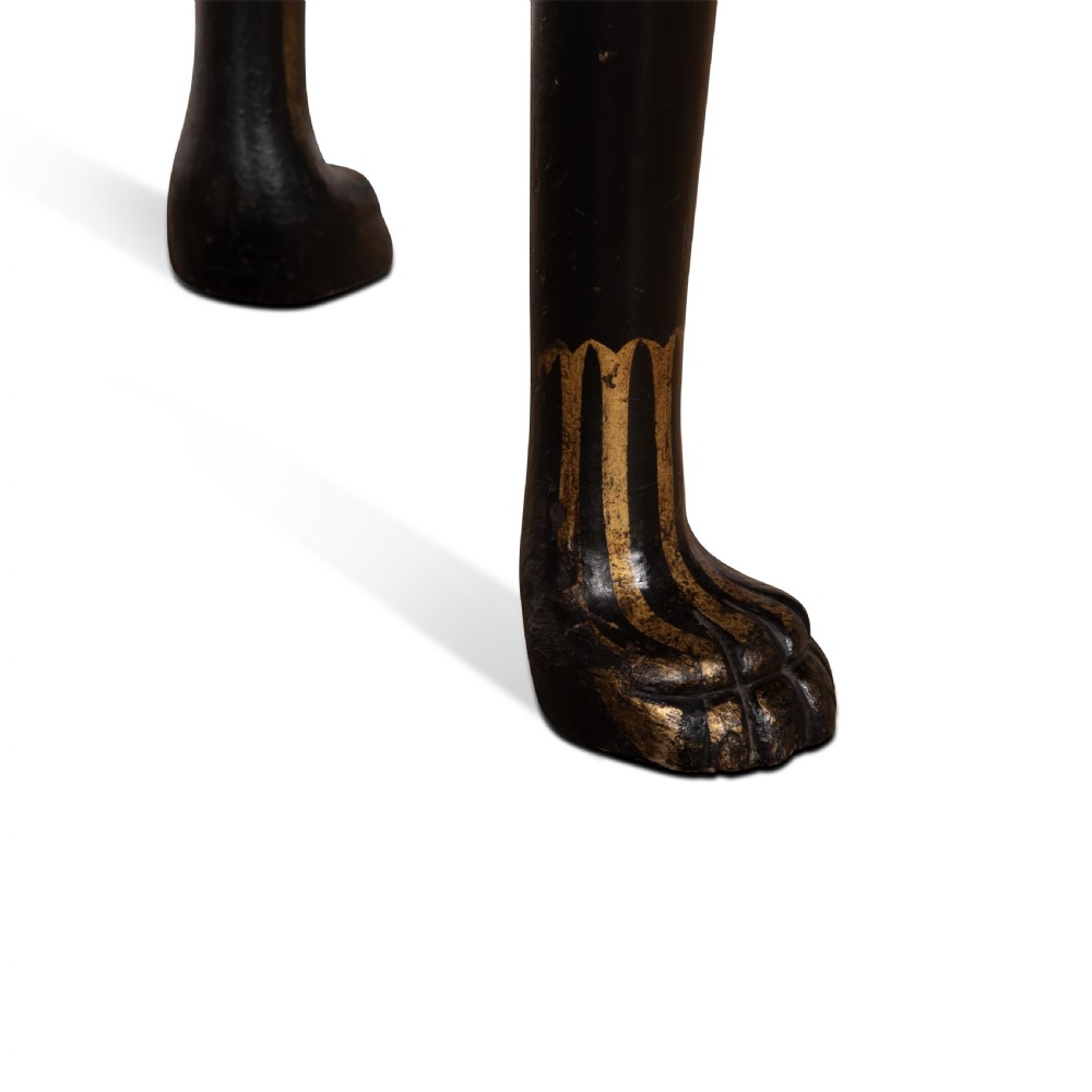 A Regency style ebonised and gilt Chinoiserie console table featuring a grey-green marble top and carved cabriole legs with paw feet. View XIV