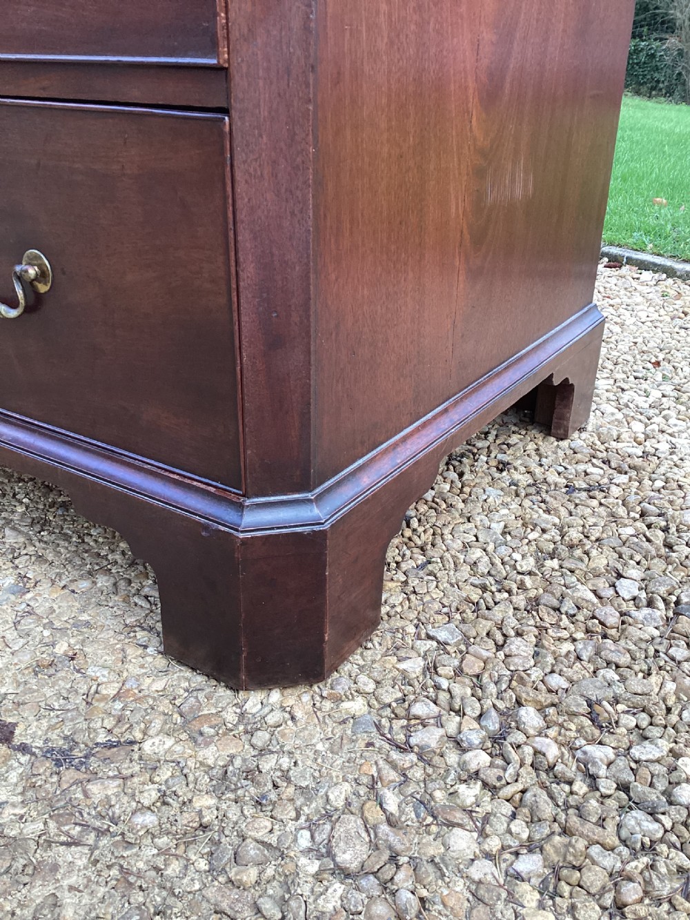 A pair of antique George II mahogany chests on chests featuring brass swan-neck handles and raised bracket feet. View XI