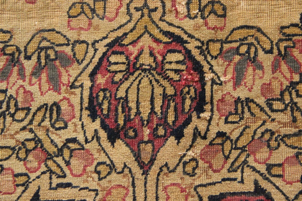 A large hand-knotted Persian Lavar Kirman carpet featuring a complex central floral medallion, intricate corner spandrels, and multi-layered decorative borders in cream, rose pink, and navy blue. View XV