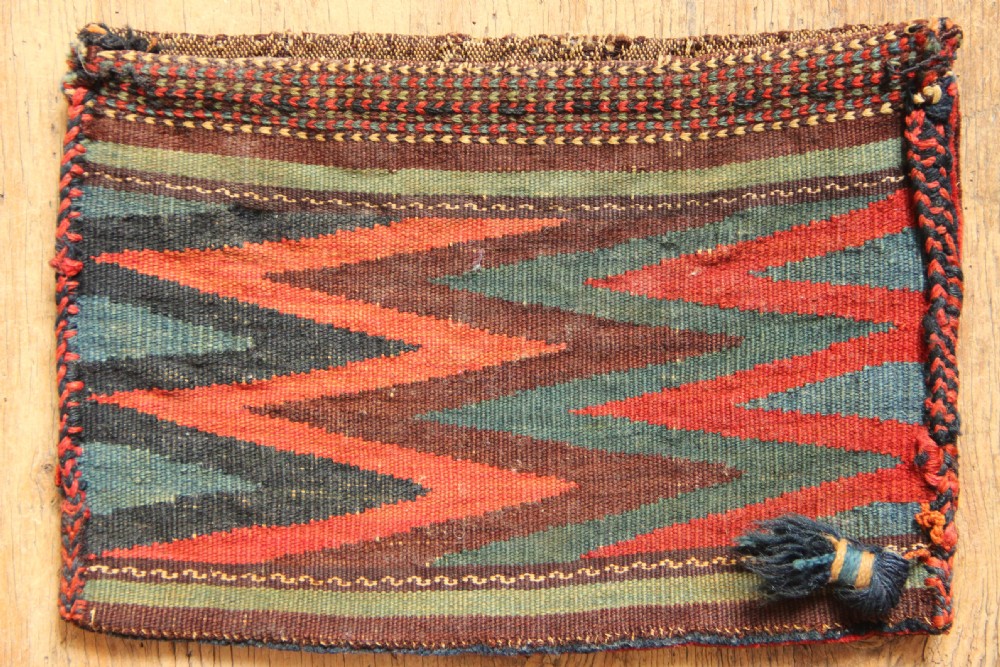 A small rectangular handwoven Persian Afshar chanteh featuring a crimson and indigo central floral motif framed by a patterned geometric border. View II