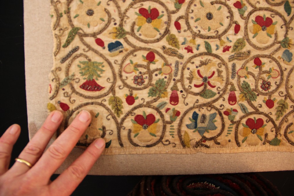 An unstitched early 17th-century rectangular linen embroidery panel decorated with scrolling metallic tendrils and polychrome silk flowers. View VI