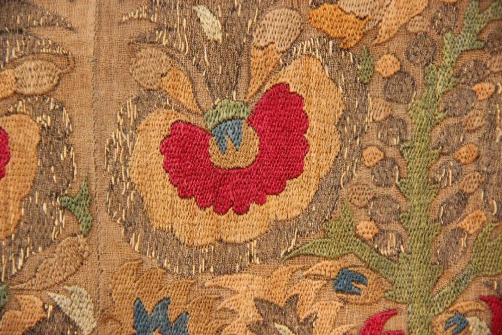 An 18th-century Greek embroidered linen panel featuring symmetrical botanical motifs stitched in red, green, ochre, and metallic thread. View VI