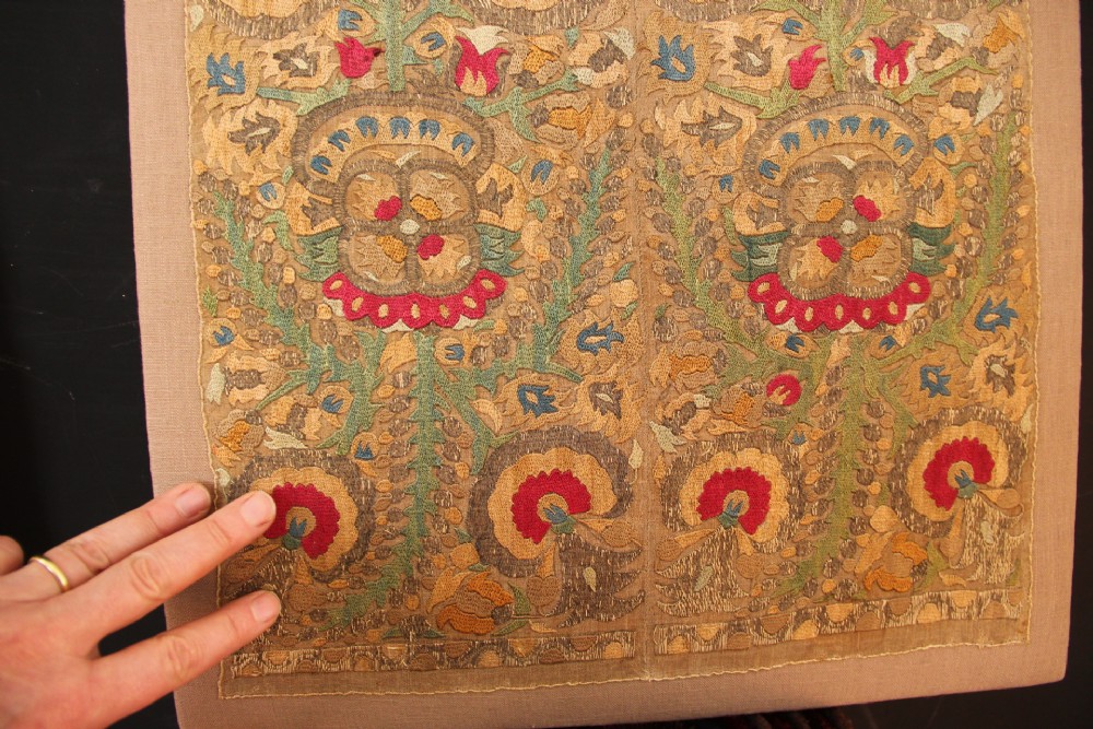 An 18th-century Greek embroidered linen panel featuring symmetrical botanical motifs stitched in red, green, ochre, and metallic thread. View VII