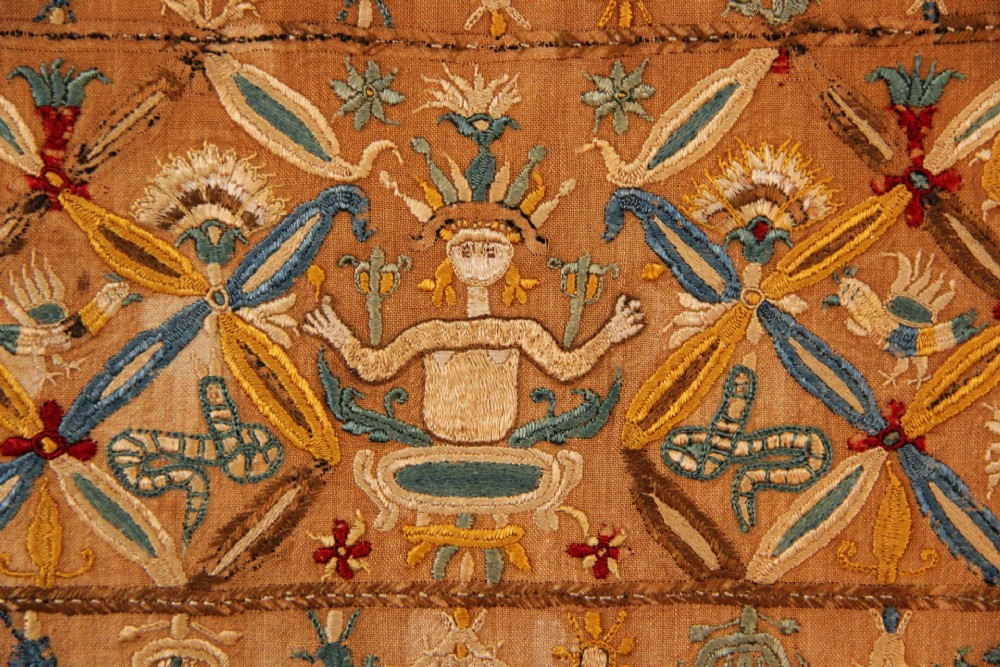 An 18th-century rectangular Cretan textile panel featuring polychrome silk embroidery on a natural beige linen ground with repeating geometric lattices, stylised human figures, birds, and floral motifs. View II