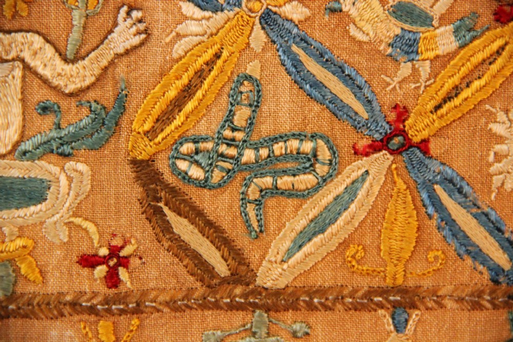 An 18th-century rectangular Cretan textile panel featuring polychrome silk embroidery on a natural beige linen ground with repeating geometric lattices, stylised human figures, birds, and floral motifs. View IV