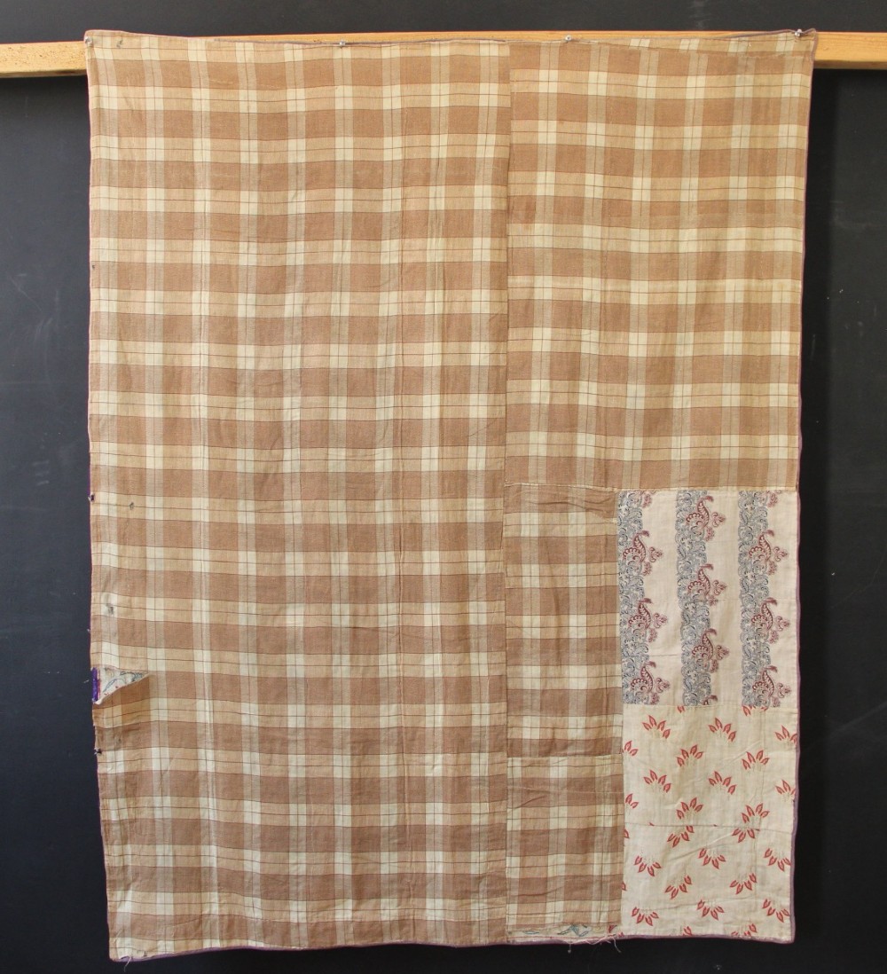 A rectangular hand-embroidered suzani textile featuring crimson floral motifs and blue scrolling vines on a cream ground. View IX