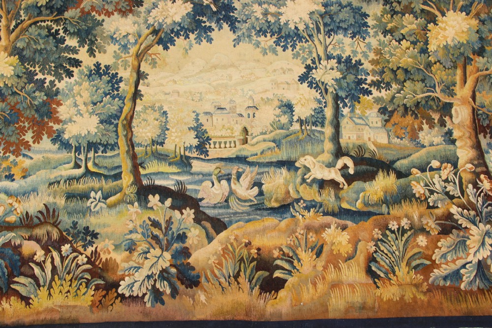 A large hand-woven French Aubusson verdure tapestry depicting swans swimming on a woodland river surrounded by trees and foliage. View II