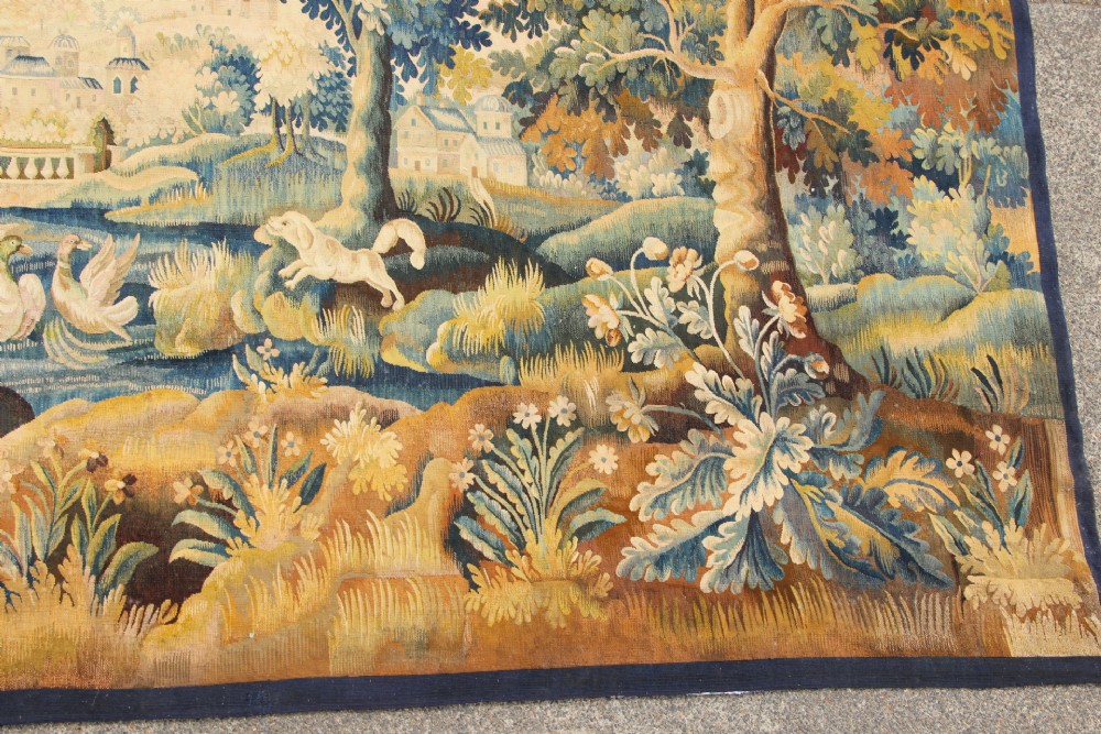 A large hand-woven French Aubusson verdure tapestry depicting swans swimming on a woodland river surrounded by trees and foliage. View III