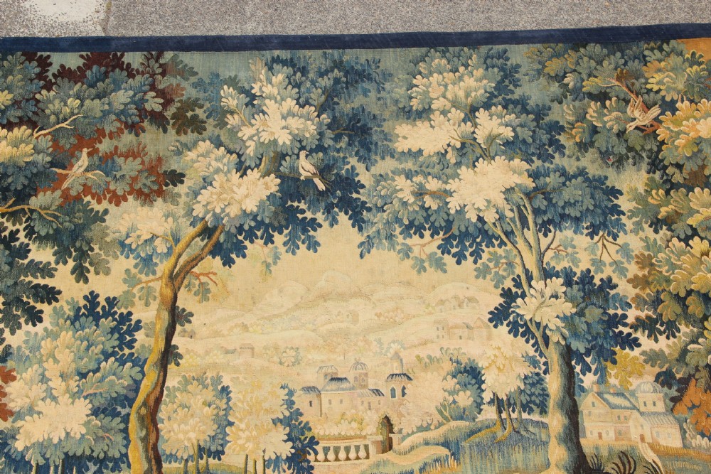 A large hand-woven French Aubusson verdure tapestry depicting swans swimming on a woodland river surrounded by trees and foliage. View VI