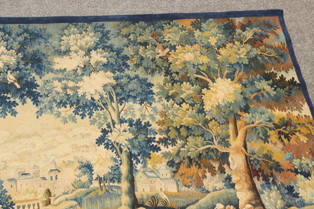 A large hand-woven French Aubusson verdure tapestry depicting swans swimming on a woodland river surrounded by trees and foliage. View VII