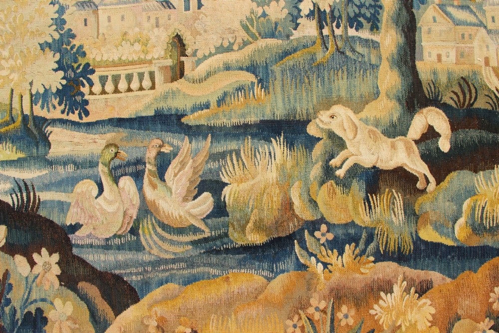 A large hand-woven French Aubusson verdure tapestry depicting swans swimming on a woodland river surrounded by trees and foliage. View IX
