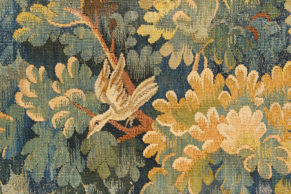 A large hand-woven French Aubusson verdure tapestry depicting swans swimming on a woodland river surrounded by trees and foliage. View XIII
