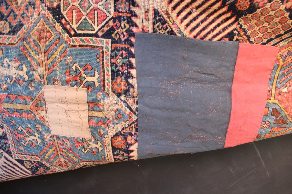 A long hand-knotted antique Caucasian Akstafa wool rug featuring geometric star medallions, stylized bird motifs, and a patterned border on a navy ground. View XII