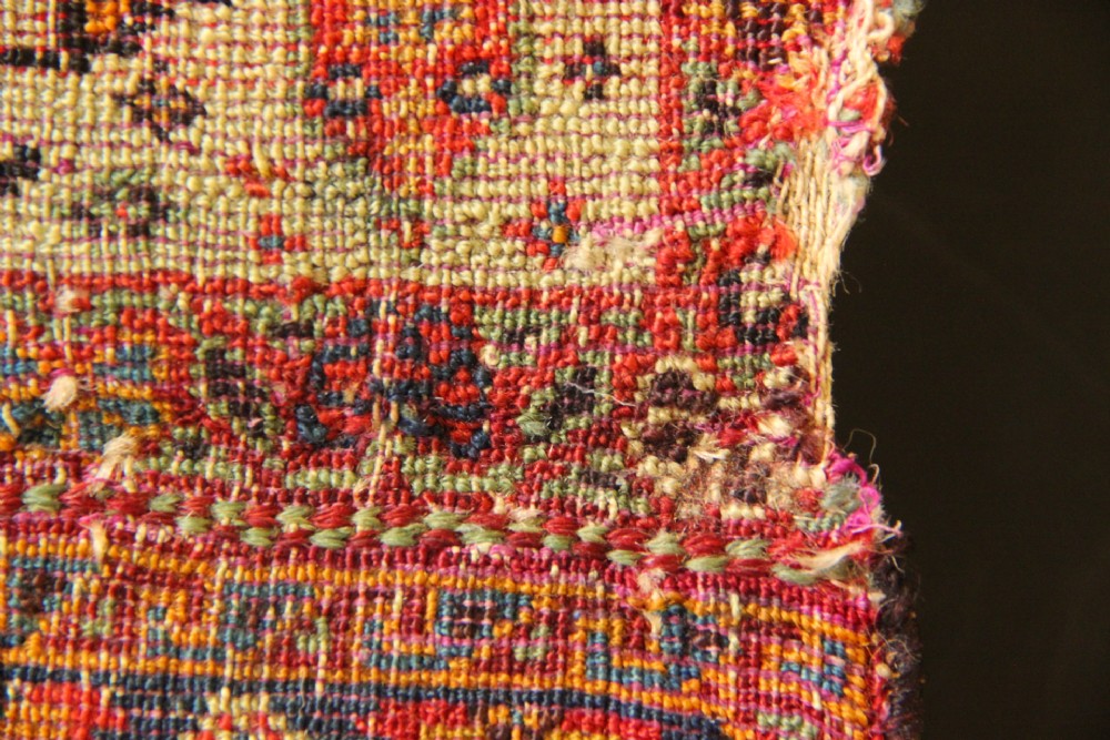 A handwoven antique Qashqai chanteh featuring red, navy blue, and cream wool with geometric diamond lattices and floral medallion patterns. View VIII
