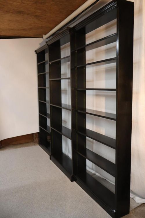 EBONISED BREAKFRONT OPEN BOOKSHELVES