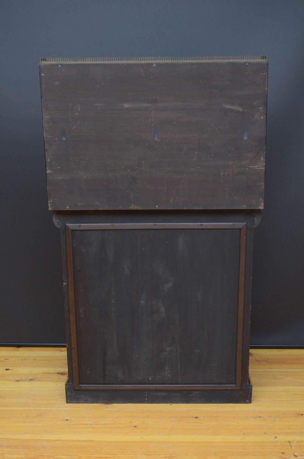 A Regency rosewood console table featuring an upper shelf tier, mirror-backed panels, and gilt carved scroll legs. View XI