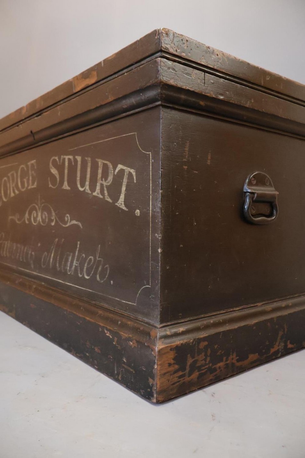 A Victorian painted wooden cabinet makers tool chest with hand-painted lettering on the front exterior and a mahogany fitted interior with geometric lid panelling. View V