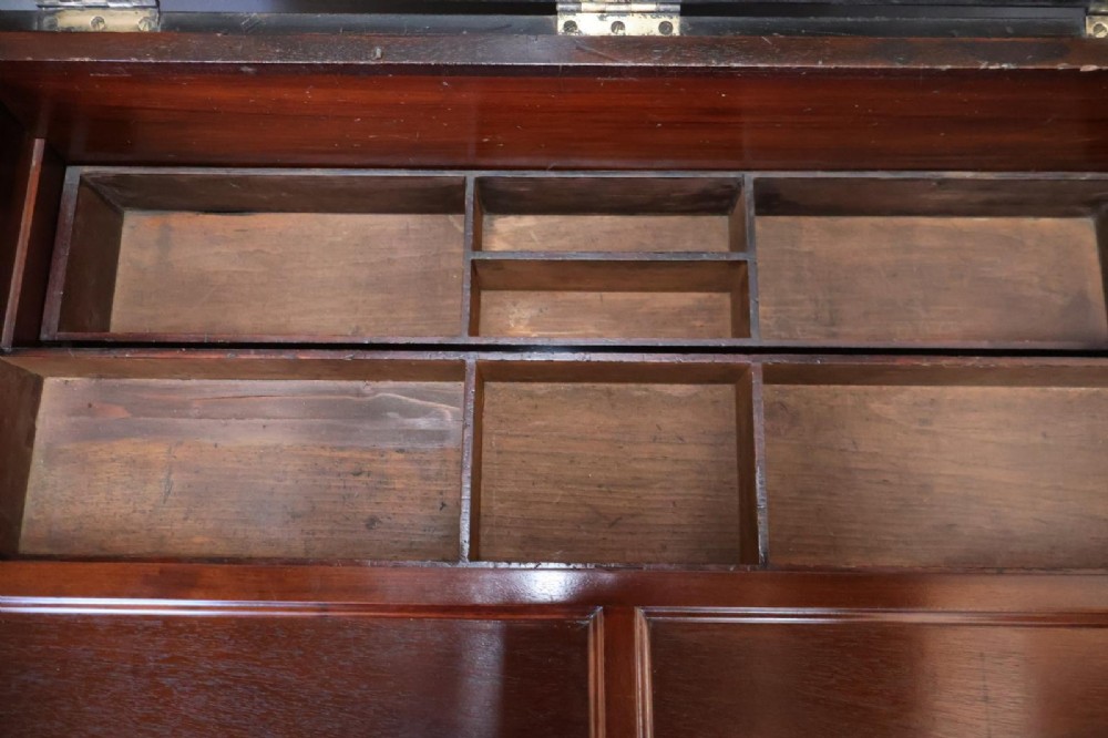 A Victorian painted wooden cabinet makers tool chest with hand-painted lettering on the front exterior and a mahogany fitted interior with geometric lid panelling. View XI