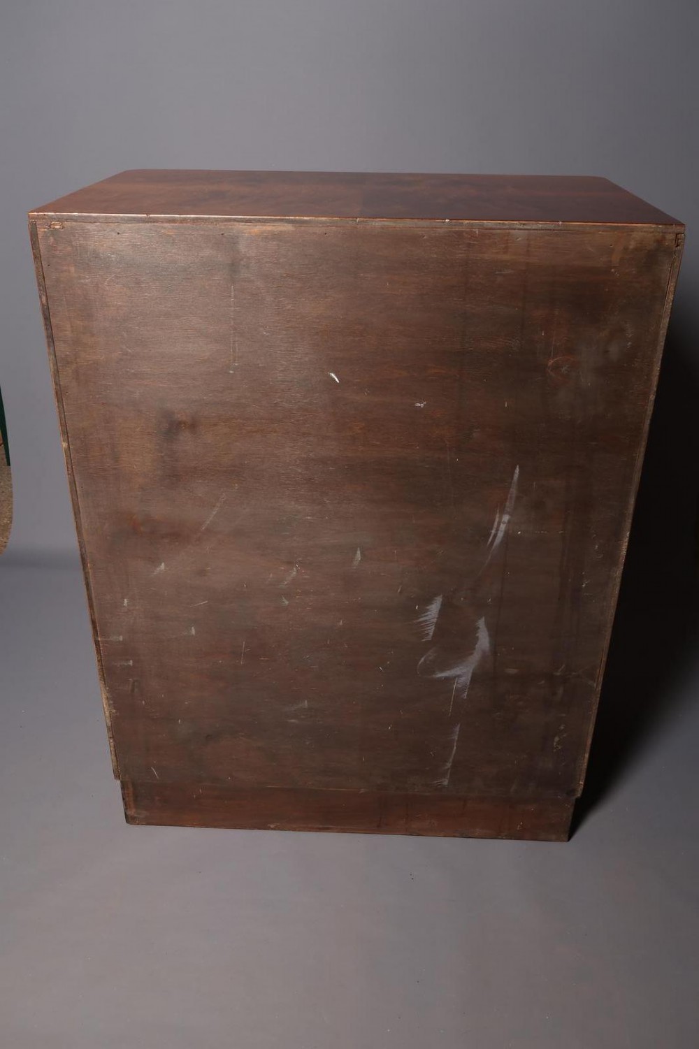 An Art Deco burr walnut compactum wardrobe featuring upper double doors, two long lower drawers, black curved handles, and an ebonised plinth. View XIII
