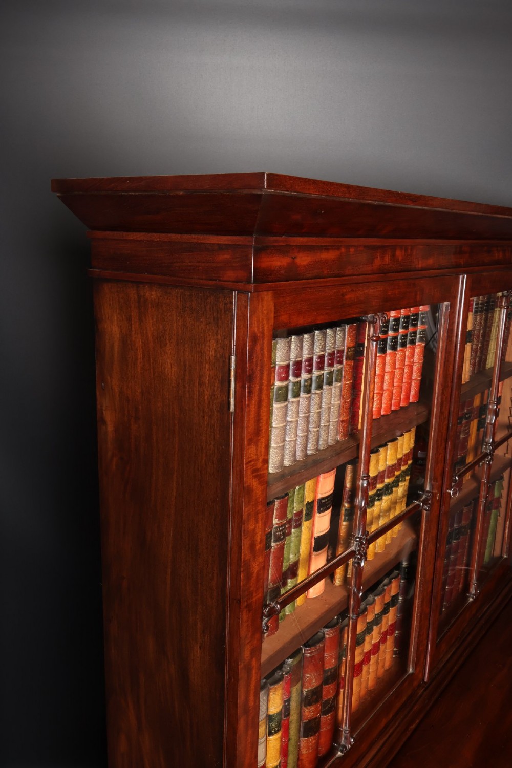 A William IV mahogany cylinder bureau bookcase featuring a two-door glazed upper cabinet, a rounded cylinder writing section, and lower cabinet doors. View VIII
