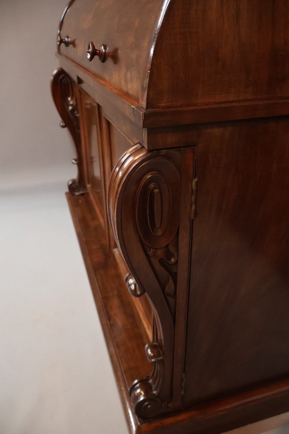 A William IV mahogany cylinder bureau bookcase featuring a two-door glazed upper cabinet, a rounded cylinder writing section, and lower cabinet doors. View IX