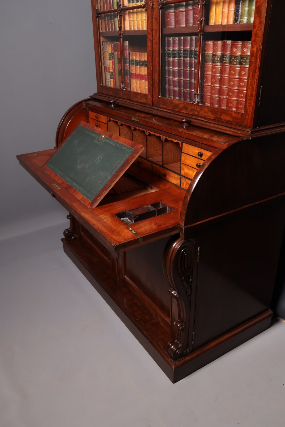 A William IV mahogany cylinder bureau bookcase featuring a two-door glazed upper cabinet, a rounded cylinder writing section, and lower cabinet doors. View XIV