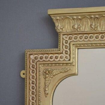 A tall, rectangular Victorian giltwood pier mirror featuring a stepped cresting cornice, beaded moulding, and arched upper frame profile. View V