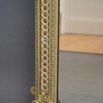 A tall, rectangular Victorian giltwood pier mirror featuring a stepped cresting cornice, beaded moulding, and arched upper frame profile. View VIII