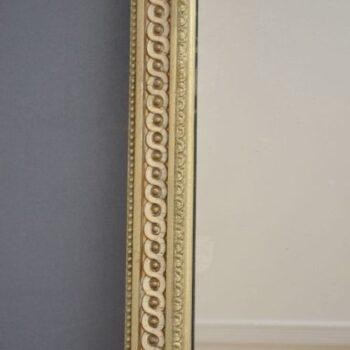 A tall, rectangular Victorian giltwood pier mirror featuring a stepped cresting cornice, beaded moulding, and arched upper frame profile. View IX
